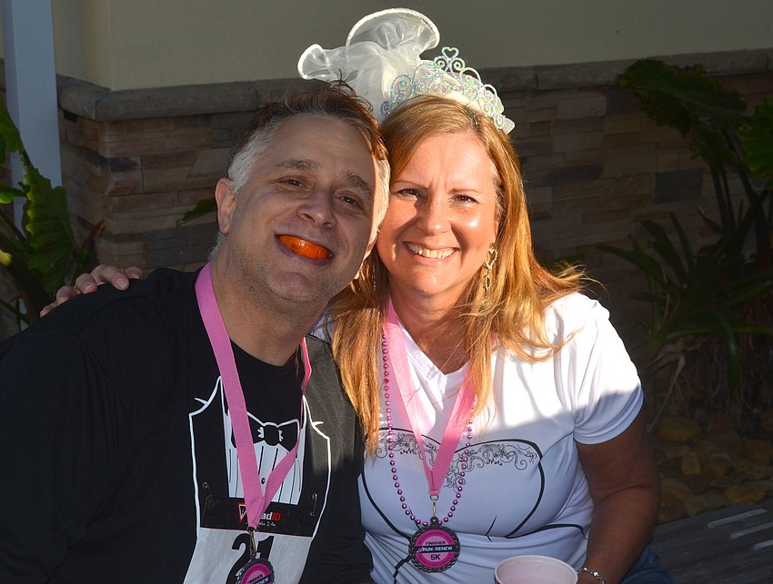 The Browns â€” Michael and Cindy â€” find a spot in the shade.