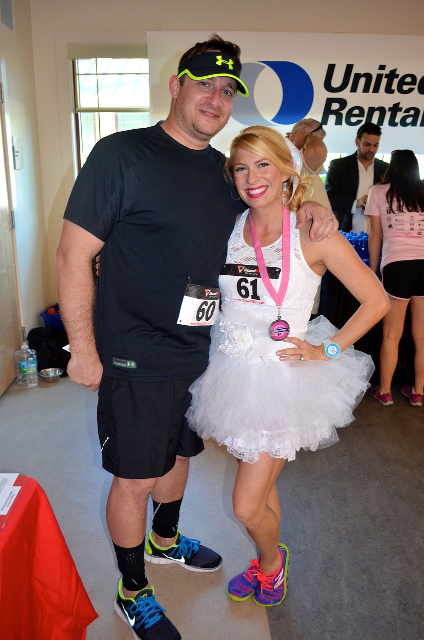 Jimmy Lassiter shows off his all-in-white wife, Kelly.