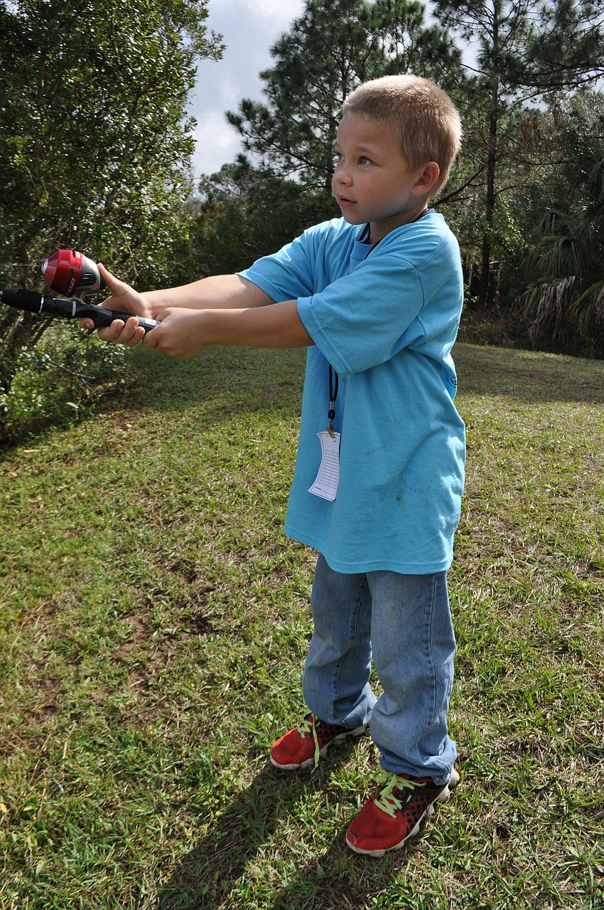 Evan Egloff, 7, shows off his casting skills.