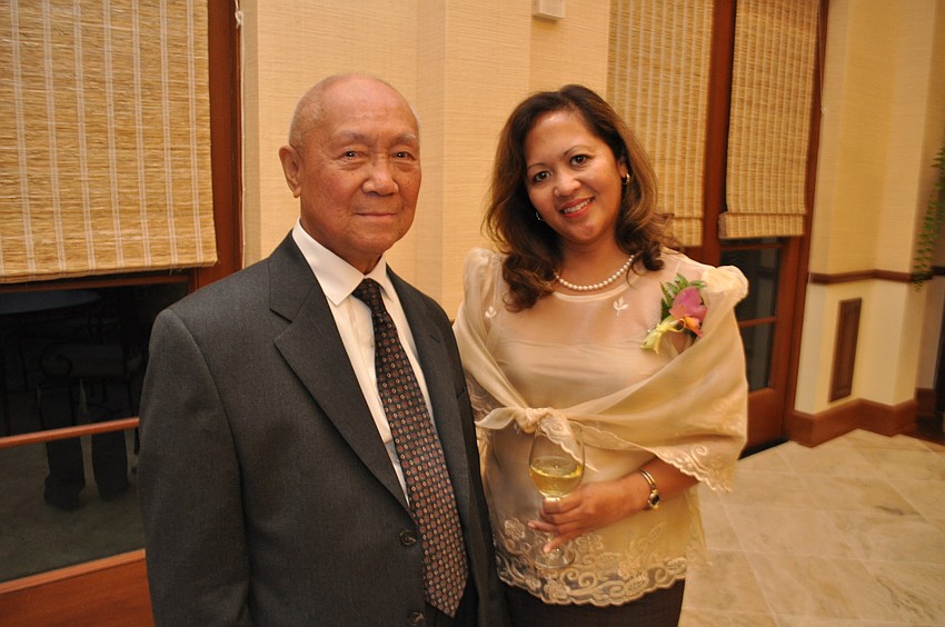 Ruben Arias, 90, attends with his daughter, Beverly Arias.