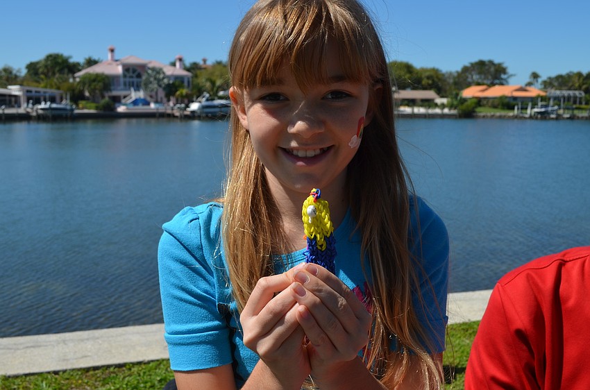 Elena Bretoi sold rainbow rubber-band bracelets.