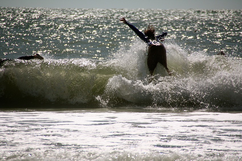 Surfers at Lido Beach.