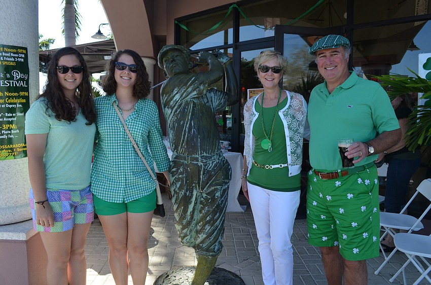 Reagan, Devin, Pam and Brian Sullivan celebrate together.