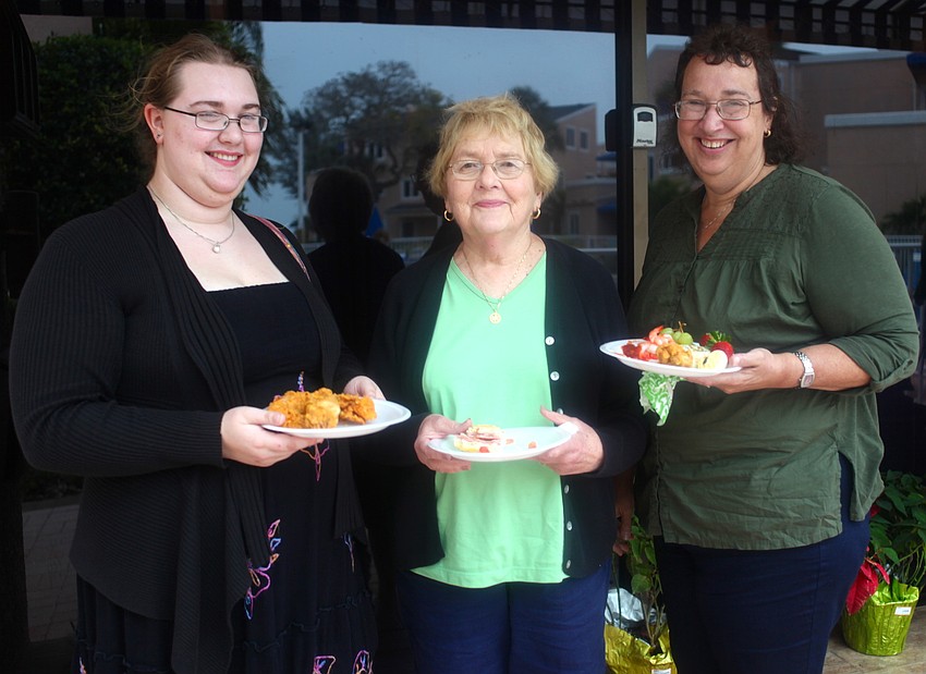 Michelle Fregeau enjoys appetizers with her grandmother, Jean, and her mother, Pat.