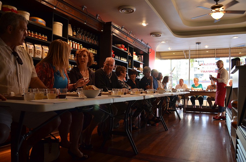 The class discusses the smell notes of the cheese they taste