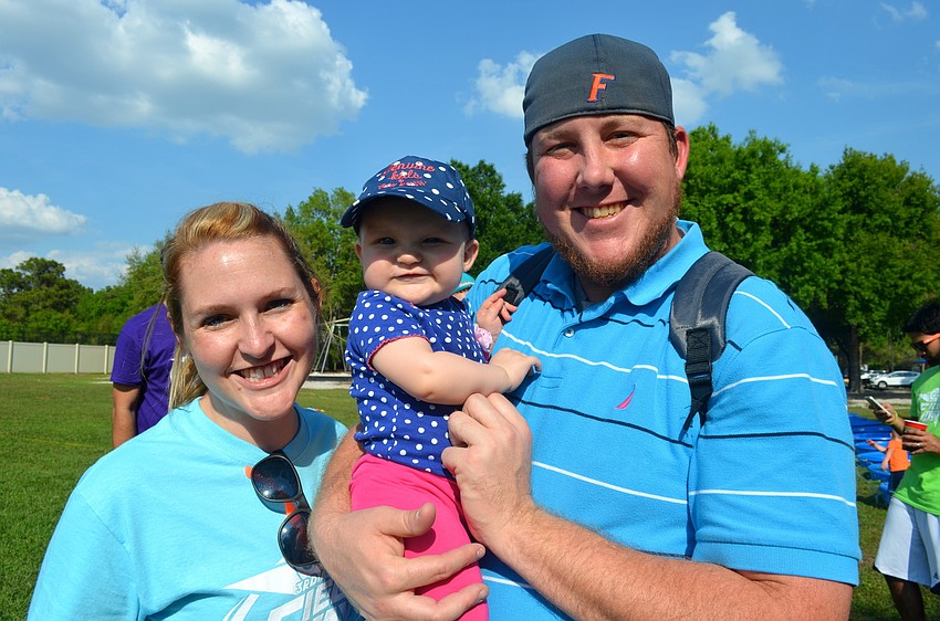 The Cigich family â€” Erin, Charlotte, 8 months, and Rich.