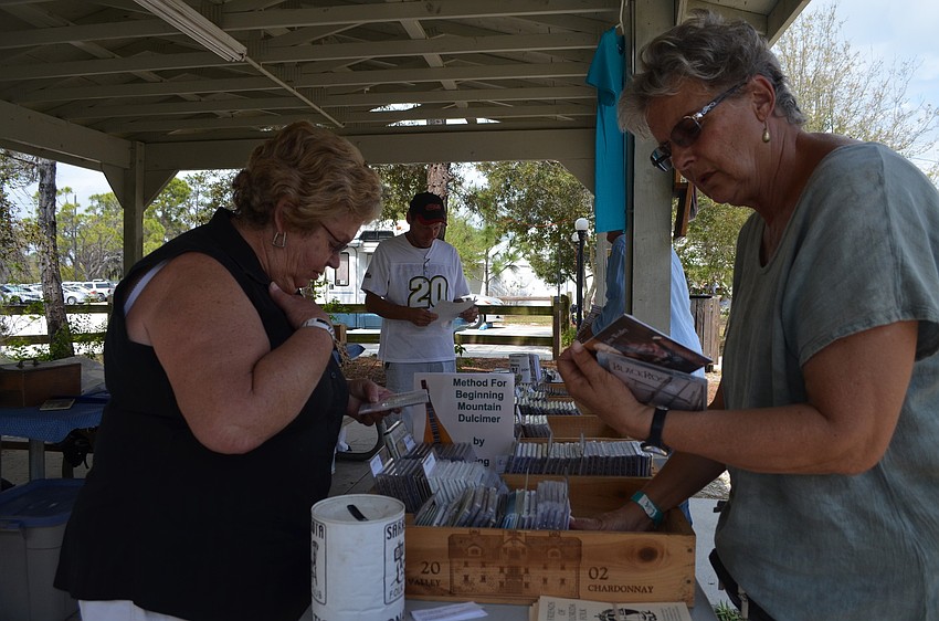 Mary Carroll and Chris Baker look through CDs.