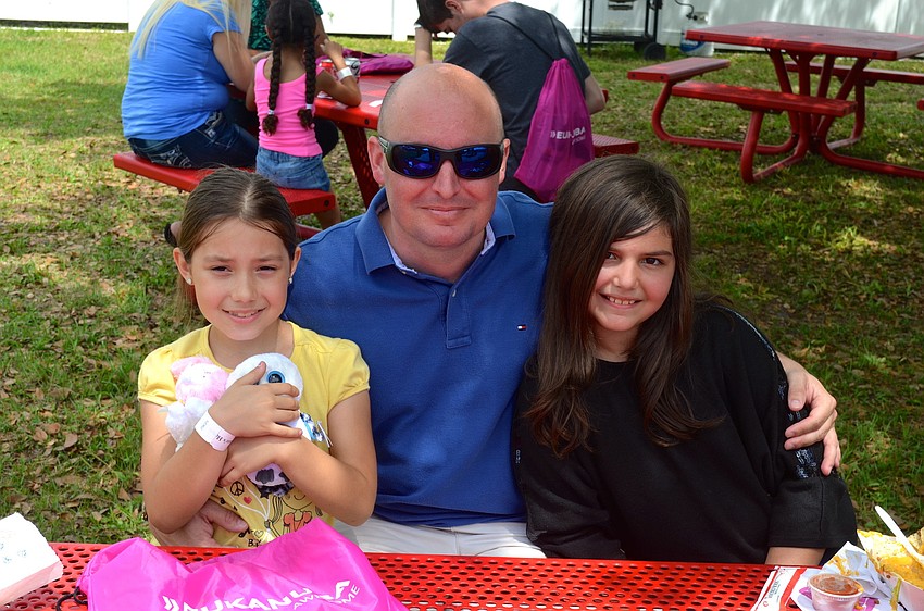 Five-year-old Isabelle Kelley, with her father, Robert, and sister, Victoria.