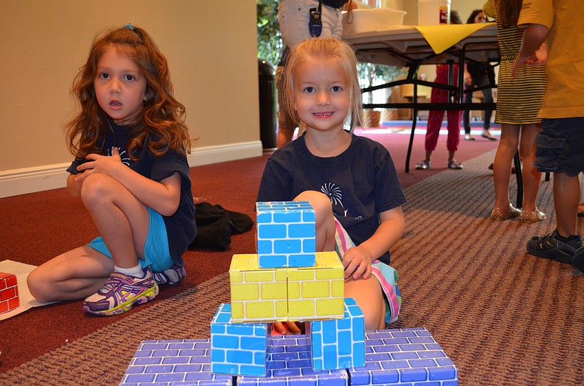 Alana Biller builds a pyramid.