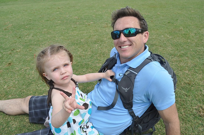 Rich Hynes relaxes with his daughter, Xan, 2