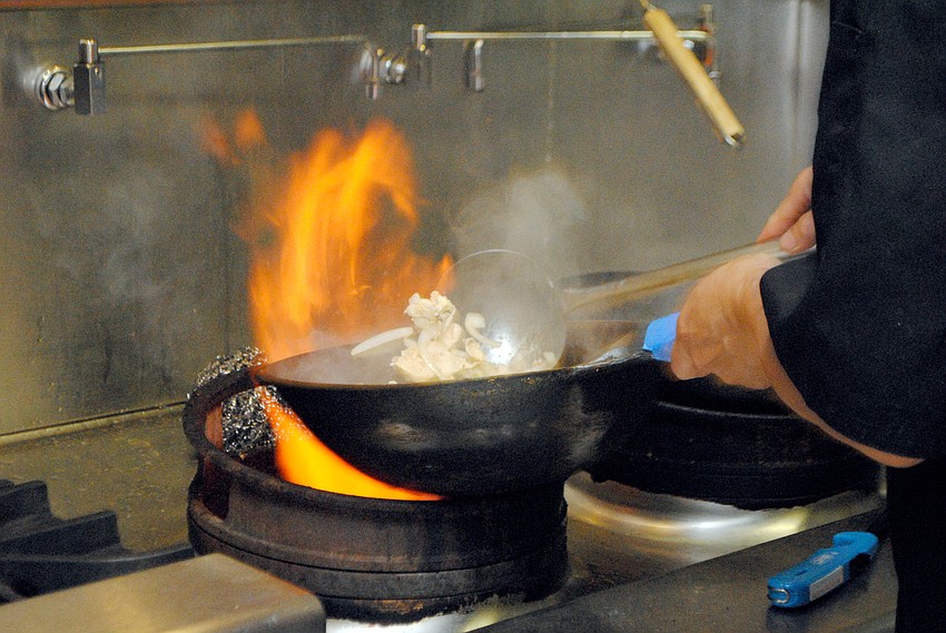 Chef Lam Lum prepares Koor Mee Lao