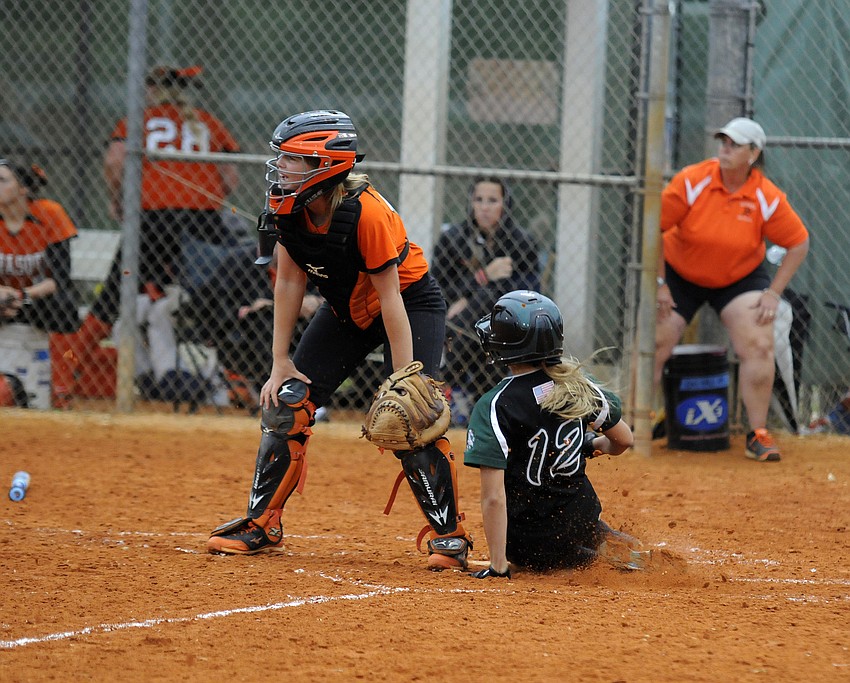 Pinch runner Mackenzie Meyer slides safely into home plate to give Lakewood Ranch a 2-0 lead.