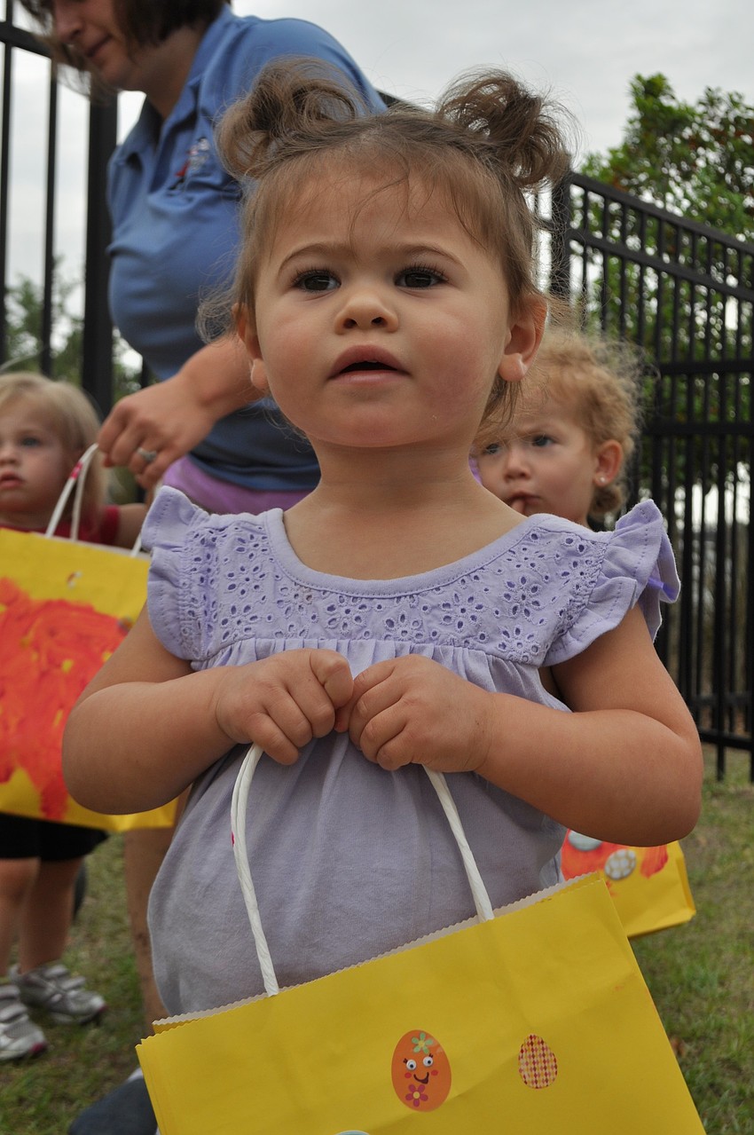 Taylor Ingallinera looks toward the Easter Bunny while hunting for eggs.