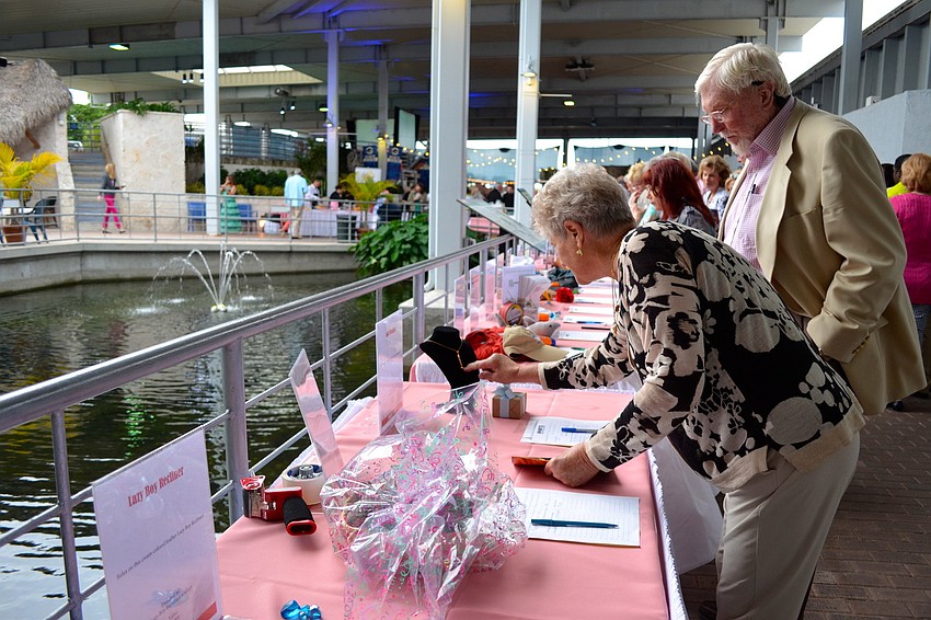 Jean and Lee Turner look at items being auctioned off.