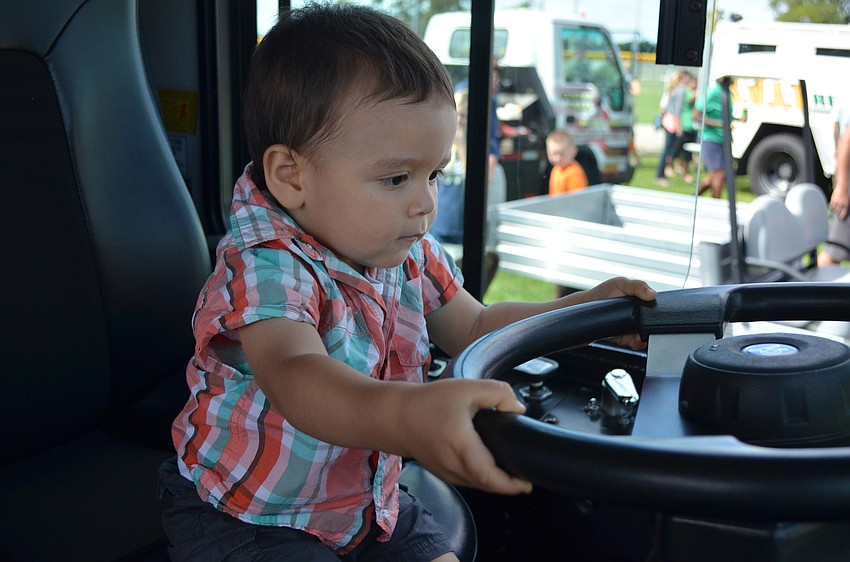 Pheonix Gomez takes the wheel of a bus.