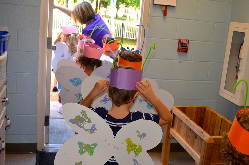 Students in Carol Beattyâ€™s VPK class get ready to release their butterflies.