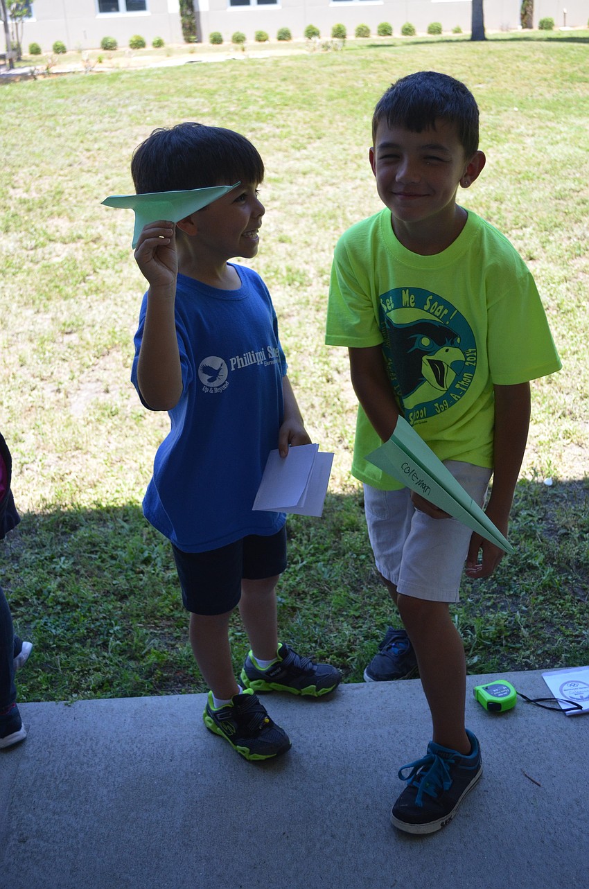 Nicolas Gonzalez and Coleman Metz with their paper airplanes.