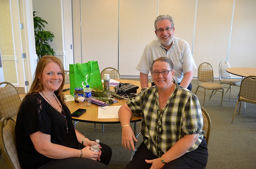 Marie Thompson, Debbie Goss and Art Sugerman complete the scavenger hunt first.
