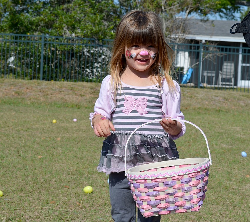 Sofia Krajewski collects eggs.