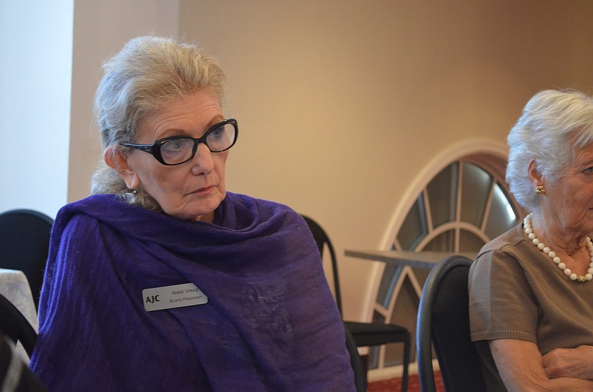 Board President of AJC Anne Virag listens to the question and answer session.