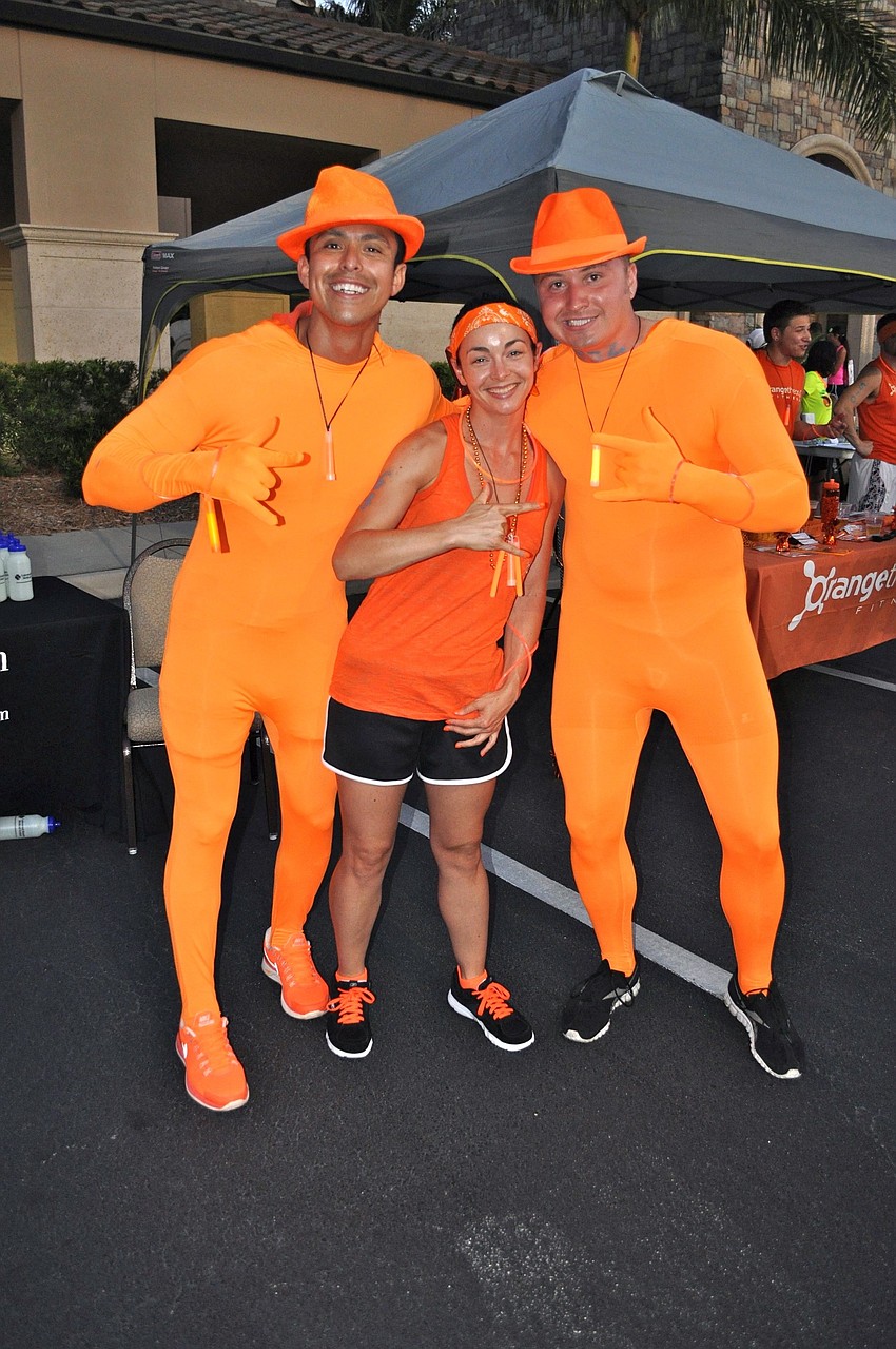 Francisco Calero, Sheri Carr and Spencer Wood of Orange Theory.