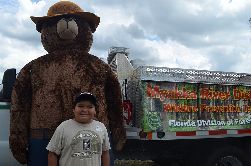 R.J. Mcabee meets Smoky the Bear.