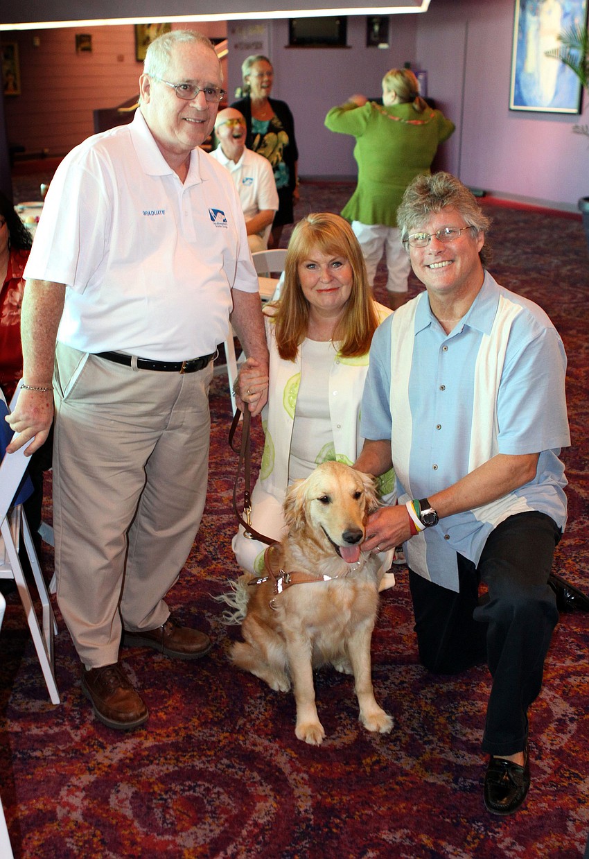 George Rorick with his new guide dog, Perle, and Perleâ€™s sponsors, Karin and Tim Stewart.
