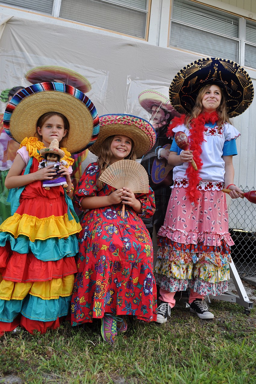 Sisters Emma, Lauren and Kate Andrews tried on festive Mexican garb for a photo session.