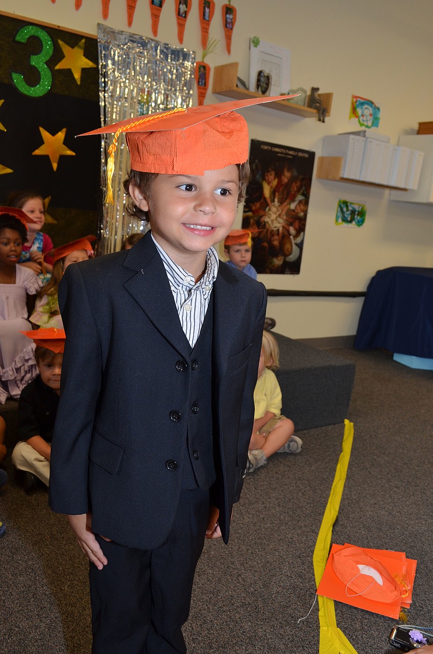 Quenton Newcomb likes to learn and read and play with his monster truck toys.