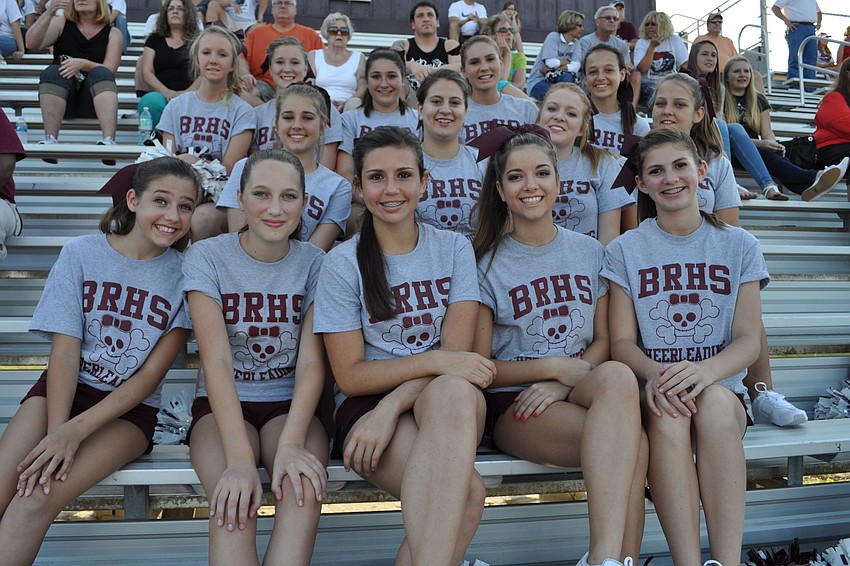 The junior varsity cheerleading team watched from the sidelines.