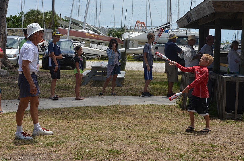 Jim Westerdale teaches Kaiden Peers how to juggle.
