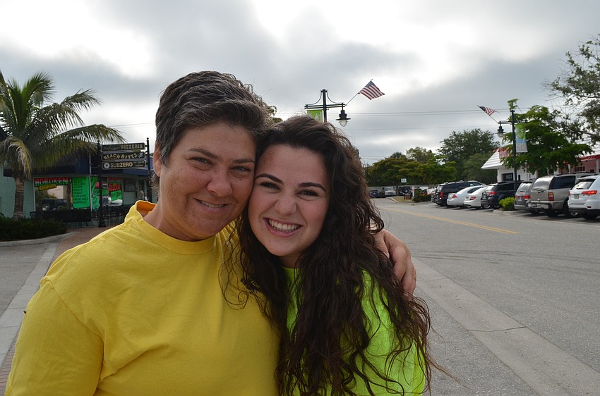 Maria Shay hugs her niece Alexandra Krusinski at the Adopt-a-Road Pickup Saturday, June1. Her niece is visiting from New Jersey.