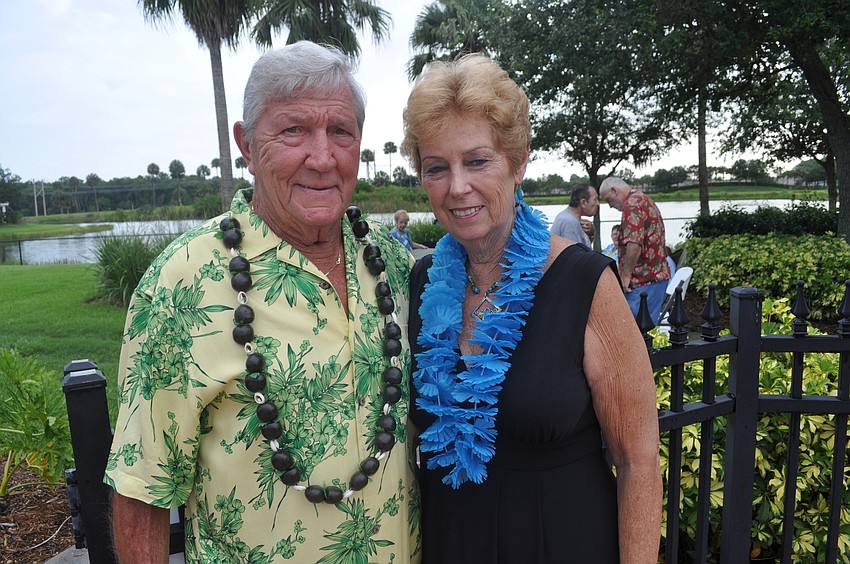 Dave and Barbara Femc looked forward to eating pulled pork cooked by Allison Betts, Stoneybrook activities director.