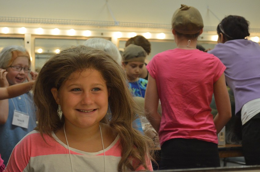 Ava Young had fun putting on different wigs.