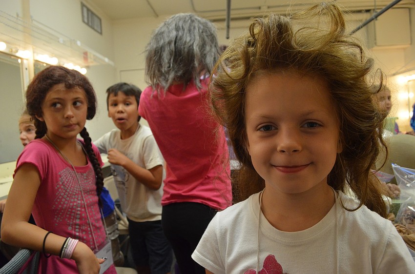 Nadya Smirnova tries on a variety of opera wigs.