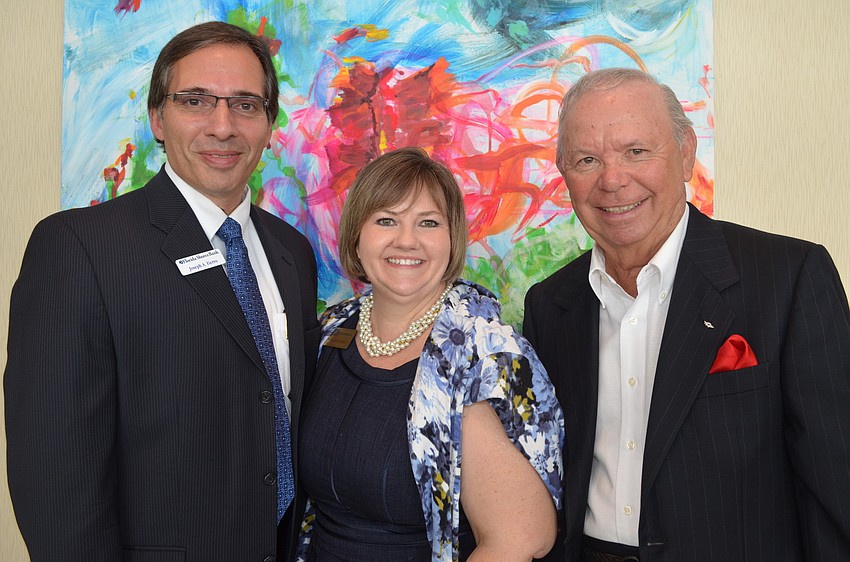 Joseph Fierro, of Florida Shores Bank, Morgan Gerhart, of the Greater Sarasota Chamber of Commerce,  and Fred Soto, of Soto Opticians