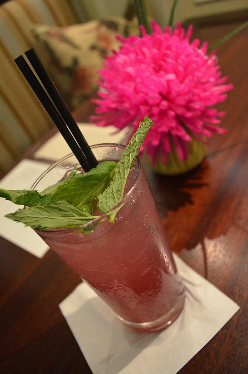 This hibiscus lime cooler is made with Ketel One Vodka, Cointreau, house made hibiscus syrup, pineapple and lime.