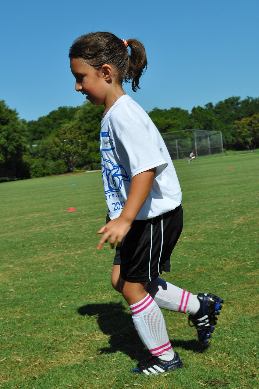 Kaylie Adams, 7, shows off her aim.