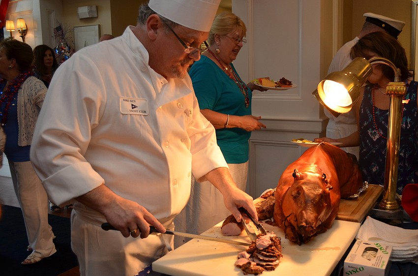Rick Wilson cuts the pig