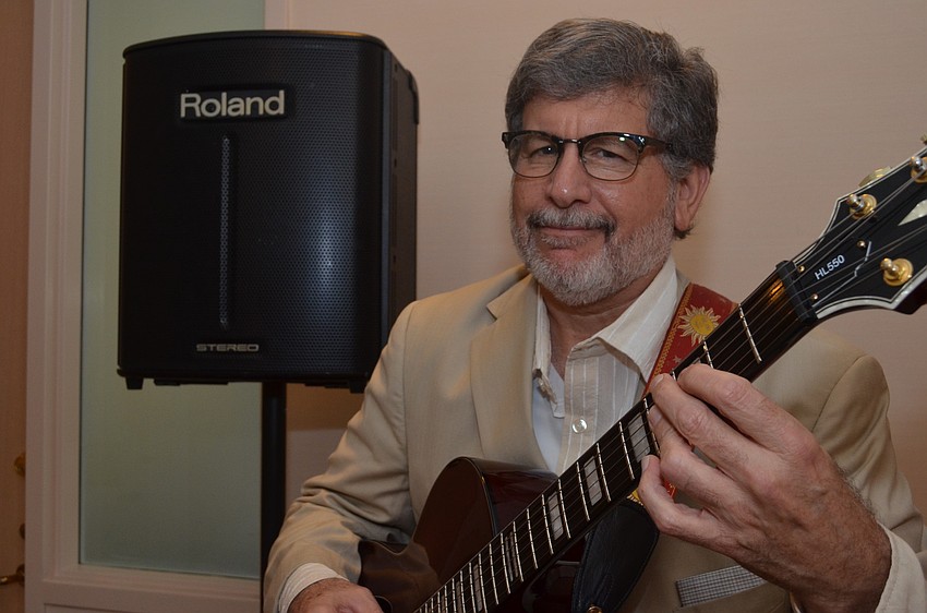 Marc Manino plays classical guitar and jazz for the Longboat Key Chamber of Commerce members.