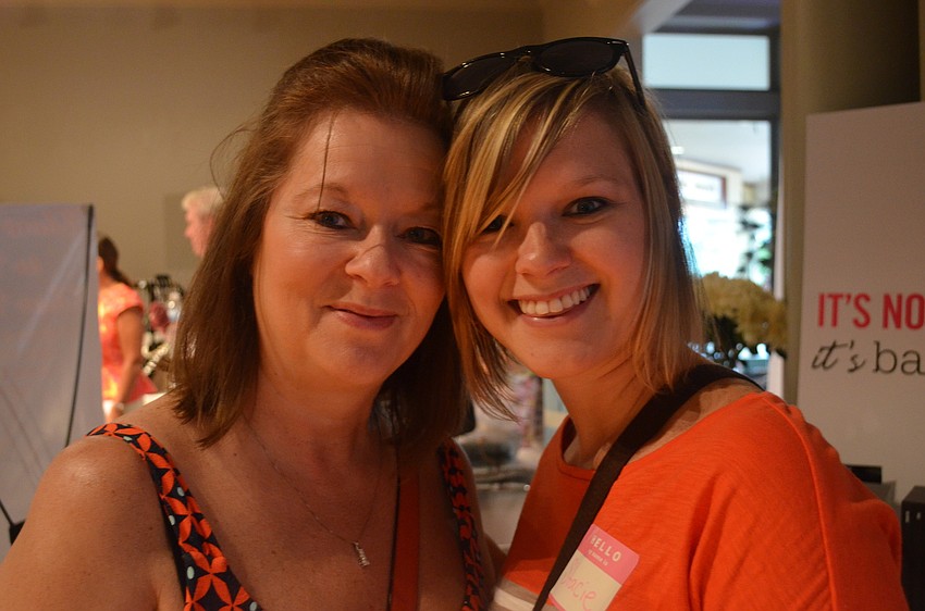 Madonna Wilcox helps her daughter Stacie Miller look for a dress. Miller will marry May 17, 2014.
