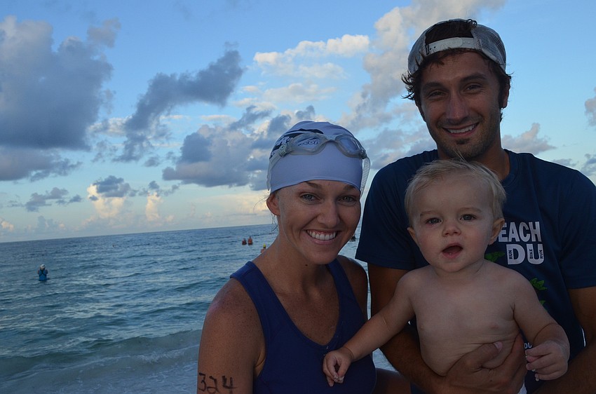 Kristen Ackermanâ€™s 1-year-old son Zane and husband Adam support her as she participates in the Sprint Triathlon.