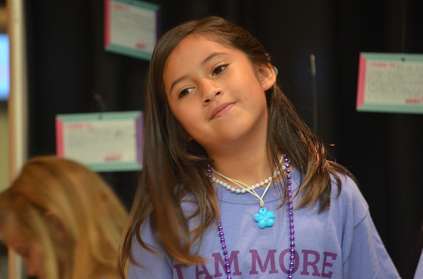 Pamela Espinosa announces the models during the fashion show.