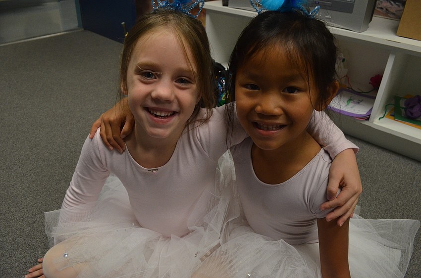 Six-year olds Sienna Cook and Roselyn Wagner talk about the activity books they made during ballet camp.