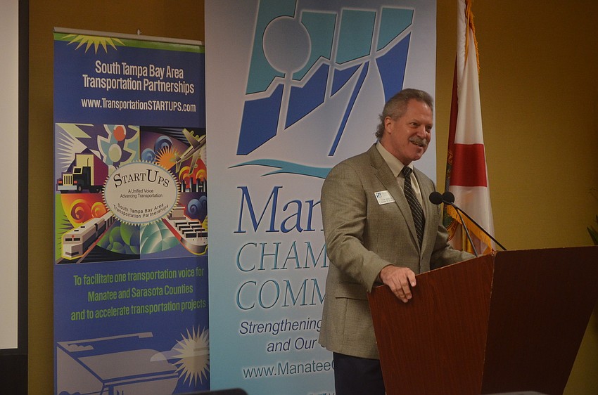 Tom Seguin of the Manatee Chamber of Commerce welcomes business members to the breakfast.