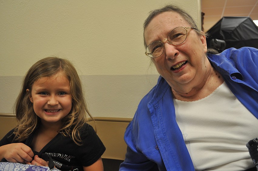 Jessica Mowrey and grand-mother Rebo Sledge sit in the hallway to talk