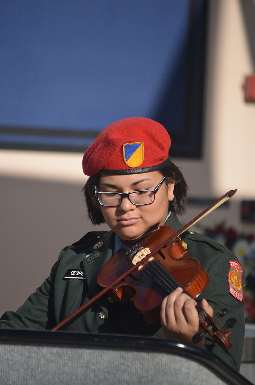 Sarasota Military Academy junior Gracie Cespedes plays the violin during the ceremony.