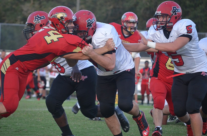 Jonah Schopfer pushes against the opposing team.