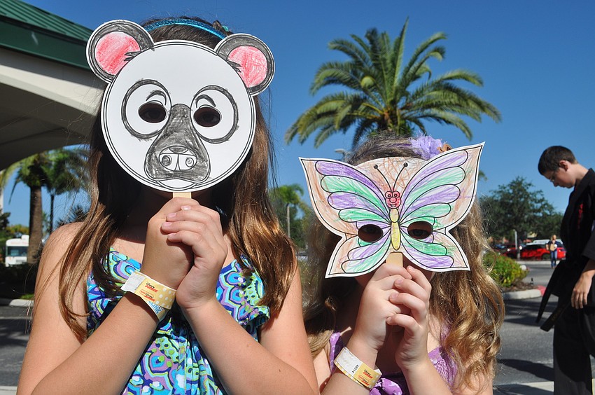 Juliana and Alexia Mattes show off their animal masks