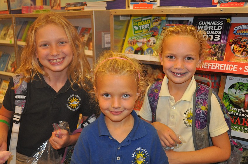 Brooke, Amber and Claire Depasquale enjoyed cotton candy and picking out a good book